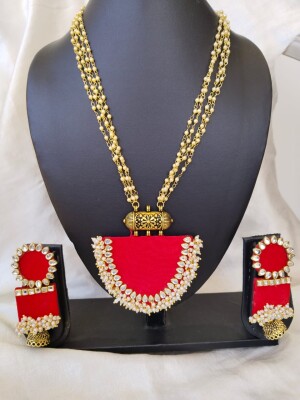 Red kundan and beads necklace earrings set