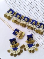 Regal blue kundan necklace, tika, and earrings set with silver and golden beads