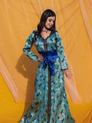 Peacock Blue Brocade Dress,Made with the rich brocade material with American crepe lining and raw silk belt with attached tassel