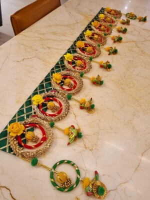Toran / Bandarwal,a traditional Indian decorative hanging garland or wreath typically made of flowers, leaves, beads.