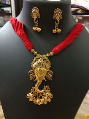 Handmade Red Thread Necklace with oxidised golden Ganesha pendant and matching earrings