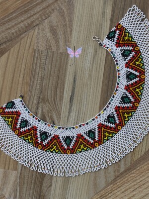 Handcrafted beaded, Blanco Bib Necklace, using white, red, orange, green, brown and black seed beads.
