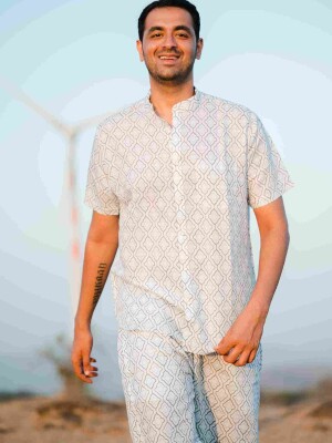 White Linen Print Men's Co-ord Set  meticulously crafted ensemble that seamlessly blends comfort with contemporary aesthetics