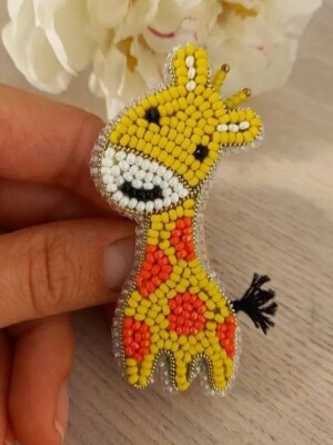 Tall Tales Hair Clip A delightful handcrafted hair clip showcasing a cute giraffe design, bringing a touch of whimsy and charm to your hairstyle
