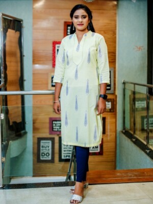 Graceful Straight Cut Light Yellow Pure Cotton Printed Kurti, ensures both comfort and style