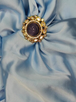 Kundan finger ring, adjustable in size, making them versatile and suitable for various finger sizes.